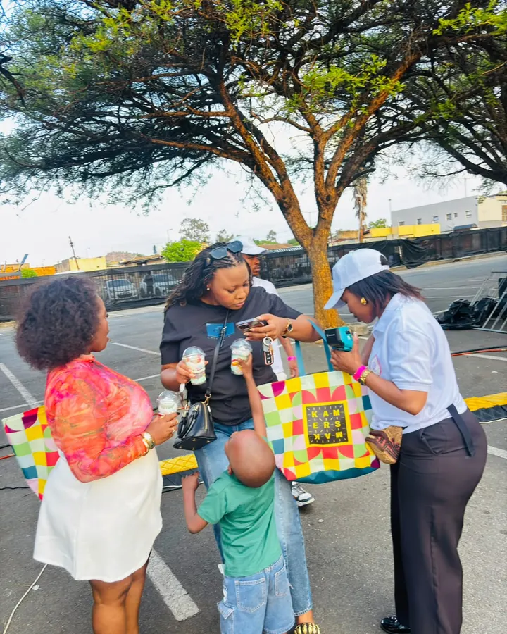 A Sedi Events server taking a card payment at an outdoor market